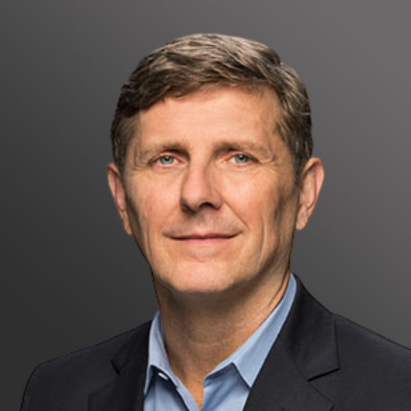 A man in a suit and blue shirt. A man in a suit and blue shirt.