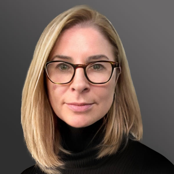 A woman with glasses and blonde hair wearing black.