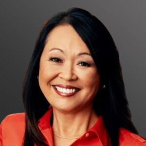 Smiling woman in a red blouse.