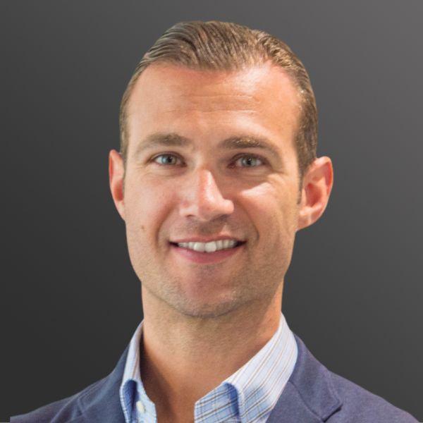 Smiling man in formal attire, gray background. Smiling man in formal attire, gray background.